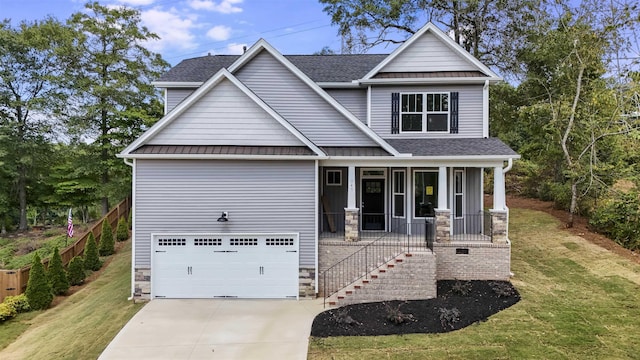 craftsman-style house with concrete driveway, stone siding, covered porch, a standing seam roof, and stairs