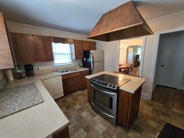 kitchen featuring ornamental molding, sink, and appliances with stainless steel finishes