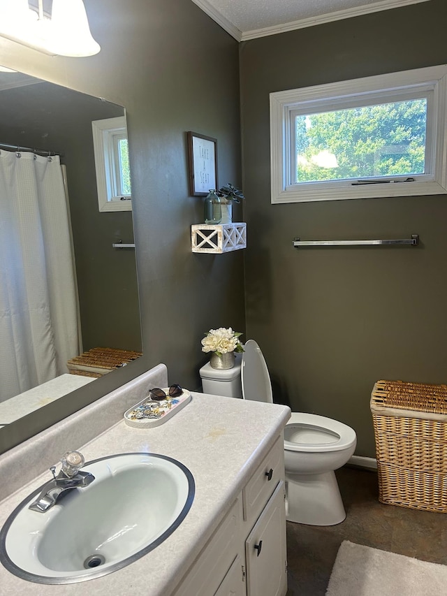 bathroom with tile patterned flooring, toilet, ornamental molding, and vanity