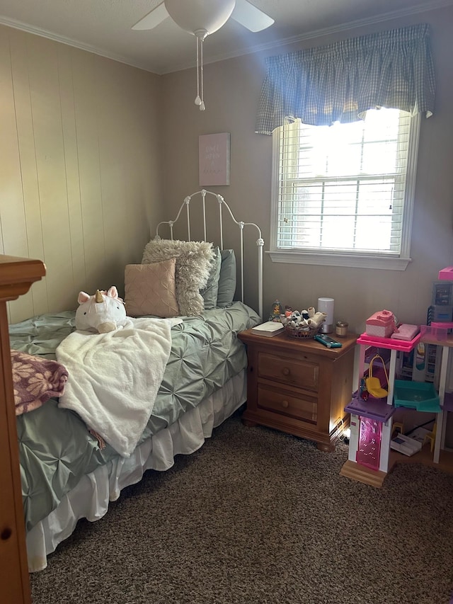 carpeted bedroom with ceiling fan and crown molding