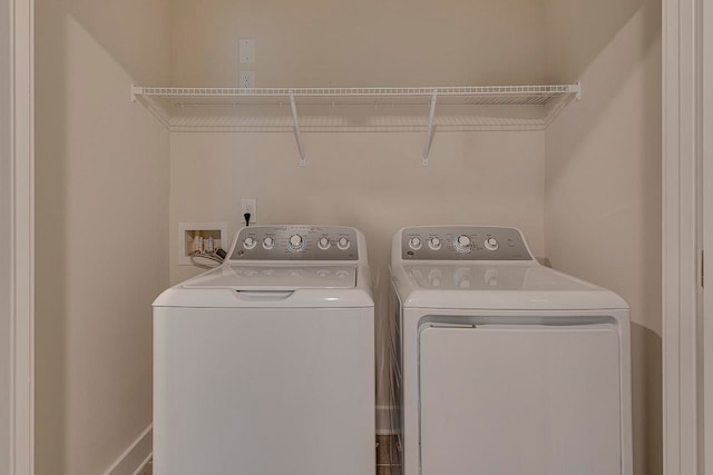 laundry area with washing machine and clothes dryer