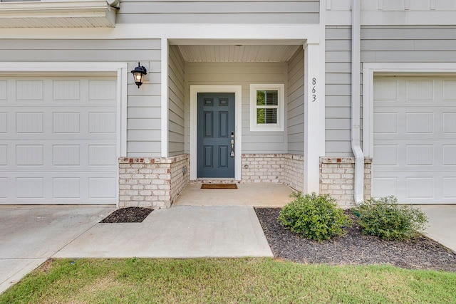 doorway to property featuring a garage