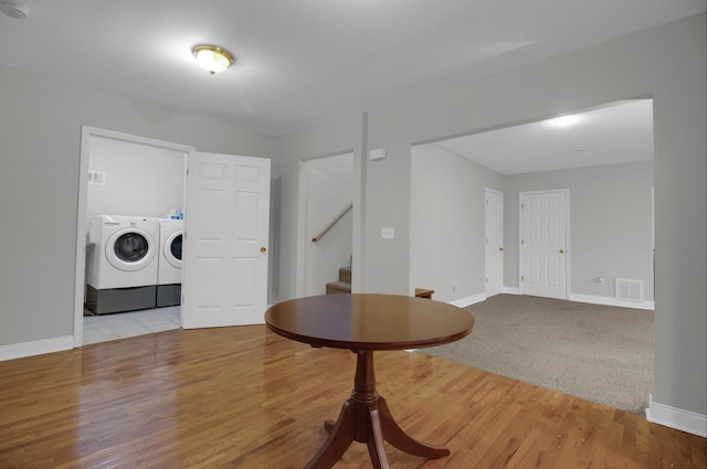 interior space featuring light hardwood / wood-style flooring and washing machine and clothes dryer