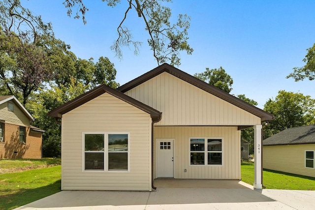 exterior space with a front yard and a patio