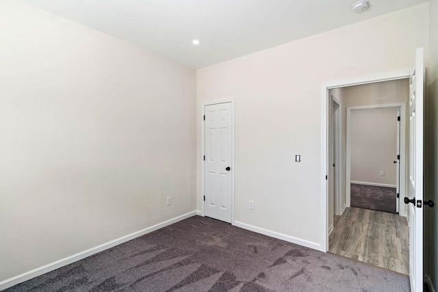 unfurnished bedroom with hardwood / wood-style flooring