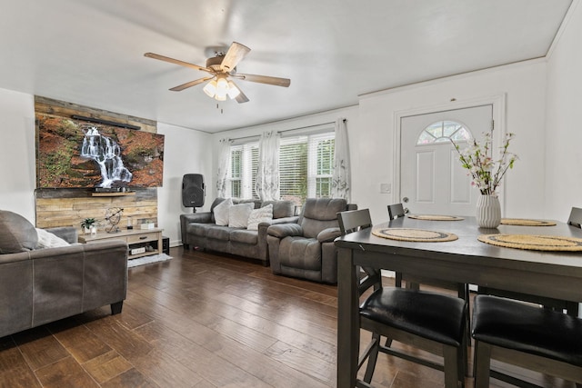 living room featuring plenty of natural light, ceiling fan, and dark hardwood / wood-style floors