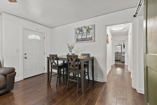 dining area featuring dark wood-type flooring