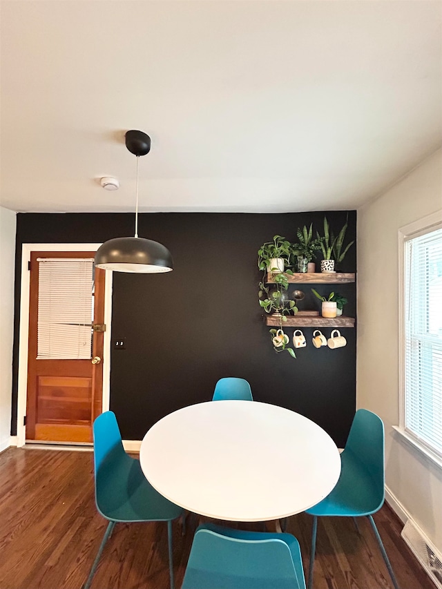 dining space featuring dark hardwood / wood-style flooring