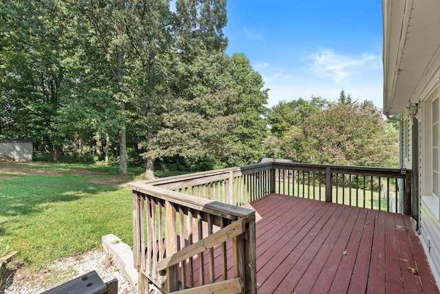 wooden terrace featuring a lawn