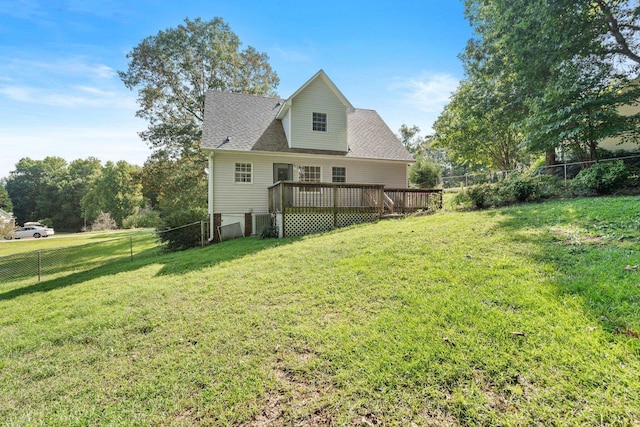 view of property exterior with a deck and a lawn