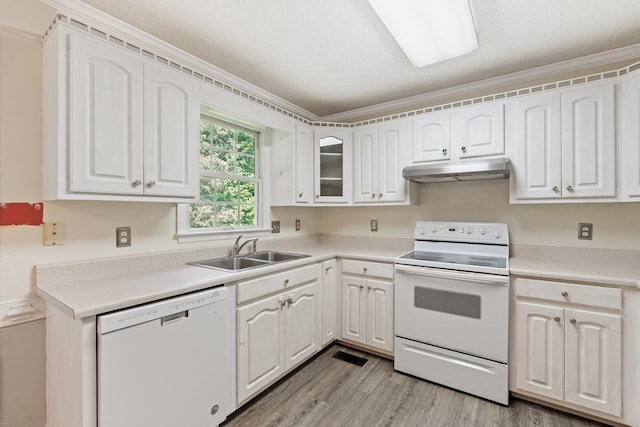 kitchen featuring white cabinets, crown molding, light hardwood / wood-style flooring, white appliances, and sink