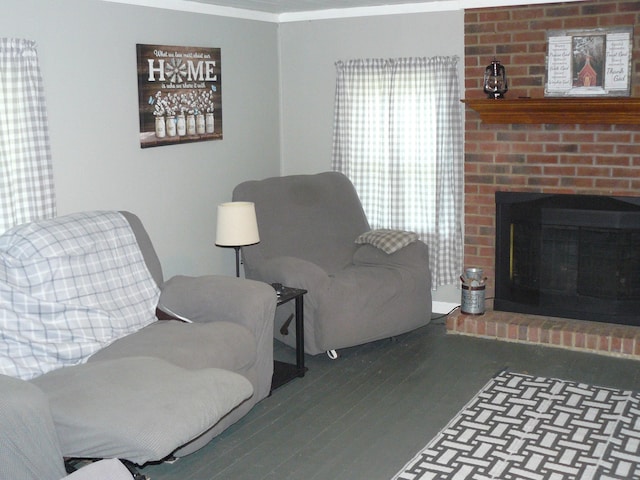 living room featuring ornamental molding, dark hardwood / wood-style floors, and a fireplace