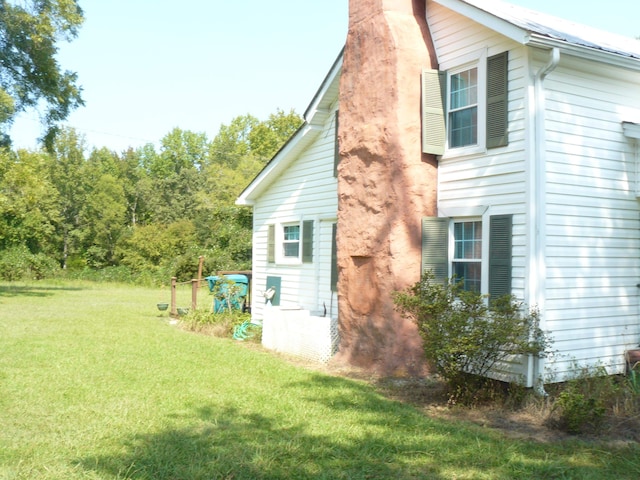 view of home's exterior featuring a lawn