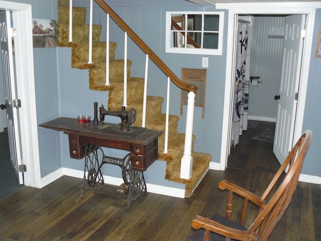 stairway with hardwood / wood-style flooring