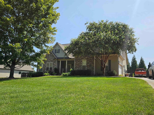 view of front of home with a garage and a front yard