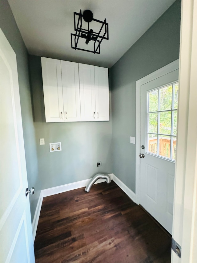 washroom featuring cabinets, dark hardwood / wood-style floors, and washer hookup