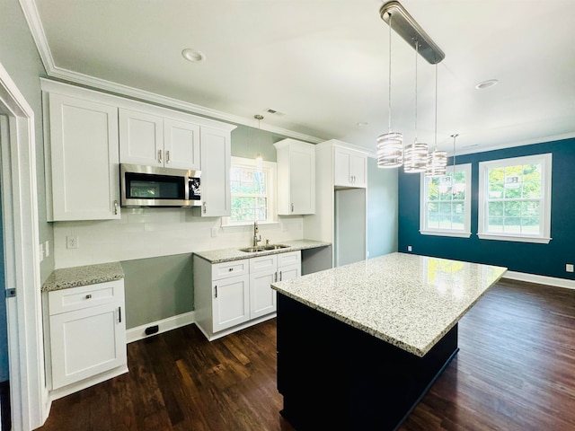 kitchen with white cabinetry and plenty of natural light