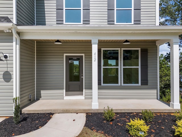 doorway to property with covered porch