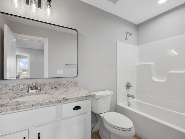 full bathroom with vanity, toilet, and shower / tub combination