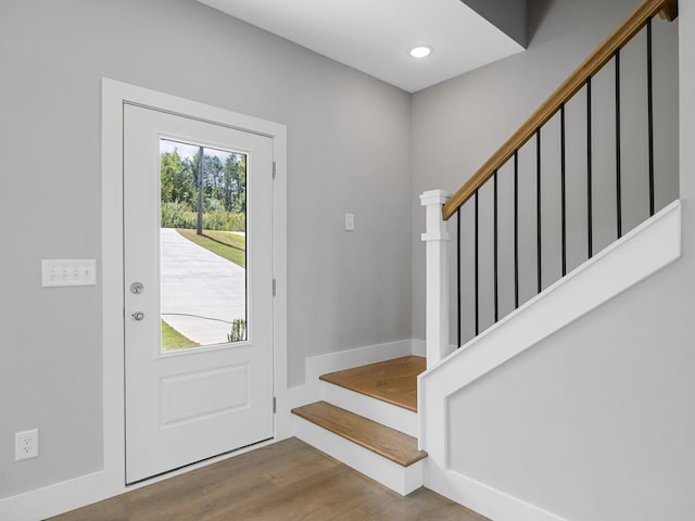 entrance foyer with a healthy amount of sunlight and hardwood / wood-style floors