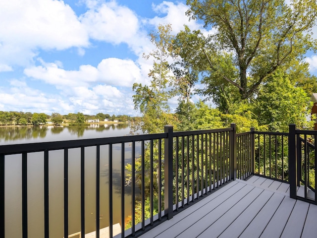 wooden deck with a water view