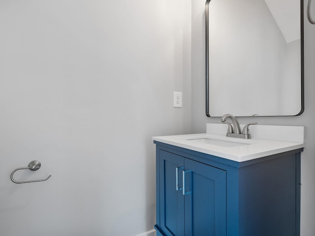 bathroom featuring vanity and vaulted ceiling