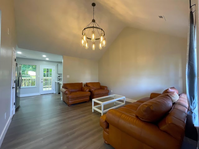 living room featuring vaulted ceiling, a notable chandelier, and dark hardwood / wood-style floors