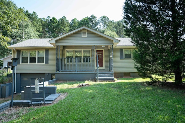 view of front of property featuring covered porch and a front yard