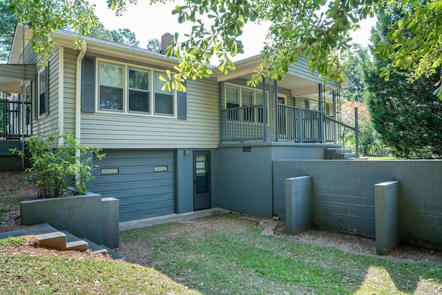 rear view of house with a garage