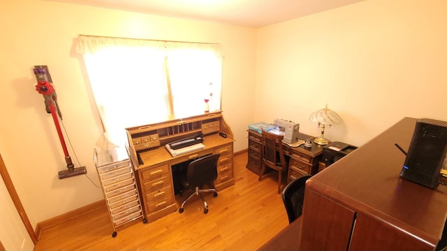 office featuring light wood finished floors and baseboards