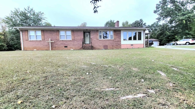 single story home featuring crawl space, a chimney, brick siding, and a front yard