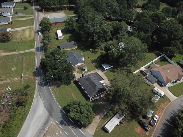 view of front facade featuring a front lawn, driveway, a porch, crawl space, and brick siding