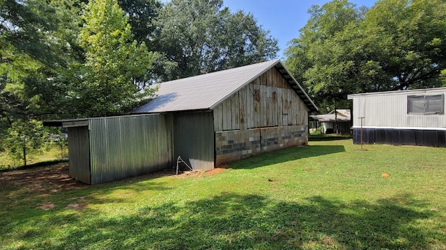 exterior space featuring a front yard and central AC