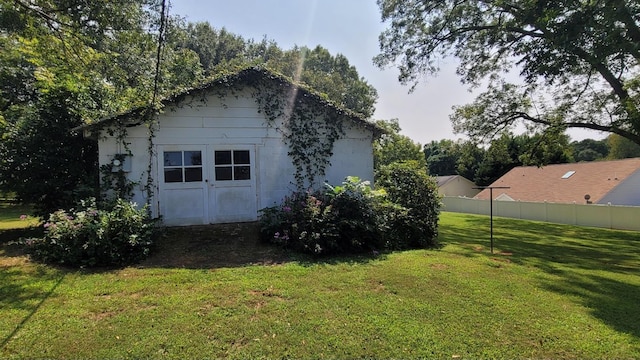 rear view of house featuring roof with shingles, a yard, a gazebo, central air condition unit, and brick siding