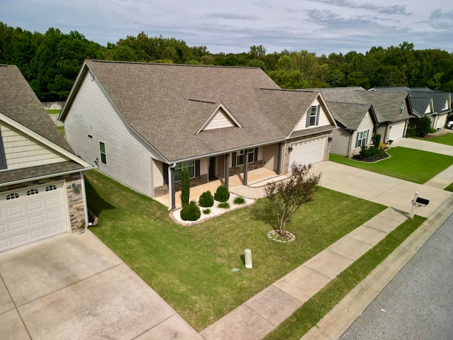 view of front facade featuring a front yard and a garage