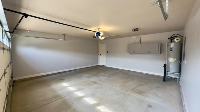 garage with electric water heater and a garage door opener