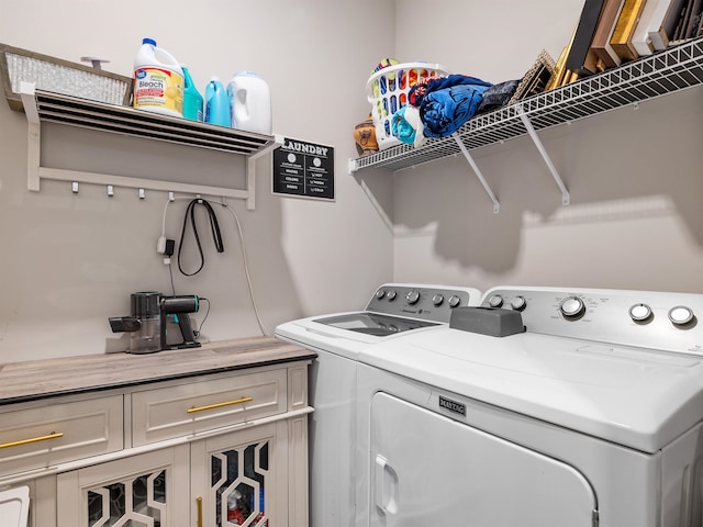 laundry area with independent washer and dryer