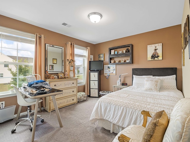 bedroom featuring carpet