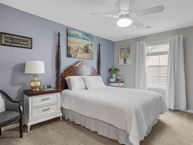 bedroom featuring ceiling fan and light colored carpet