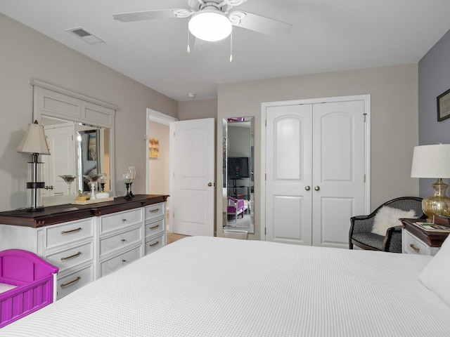 bedroom with ceiling fan and a closet