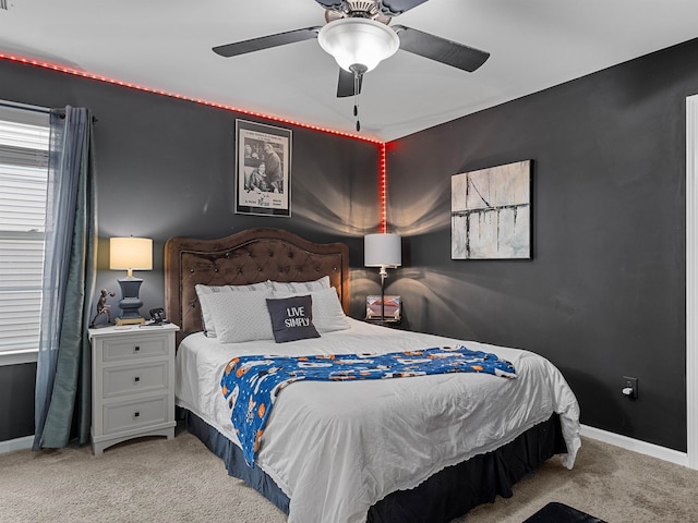 bedroom with ceiling fan and light carpet