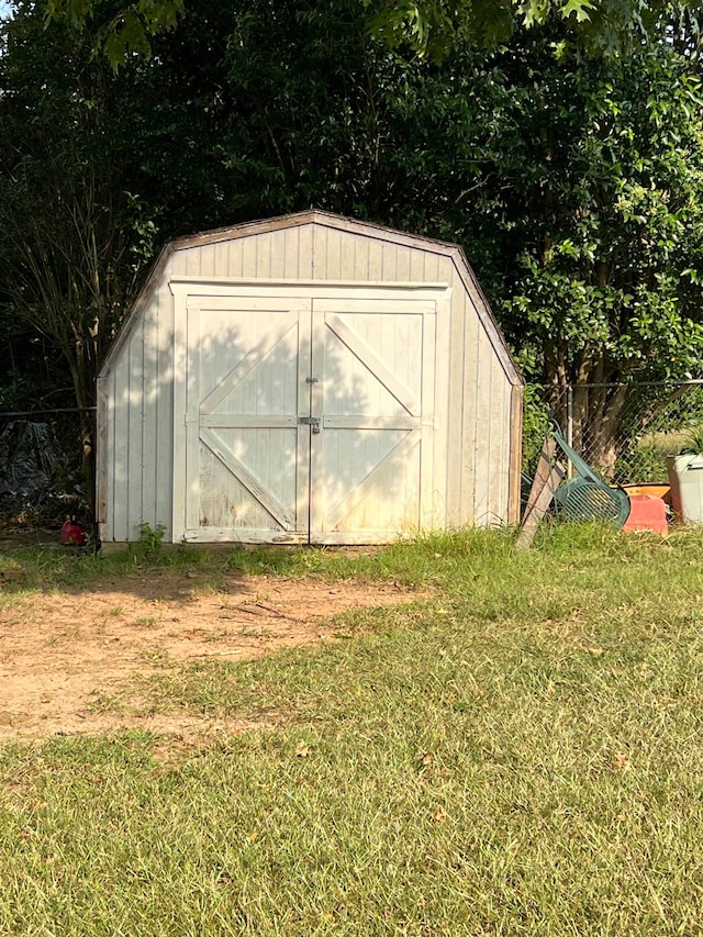 view of outdoor structure with a lawn