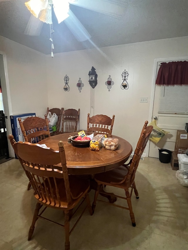 dining space featuring ceiling fan