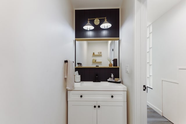 bathroom featuring vanity and hardwood / wood-style flooring