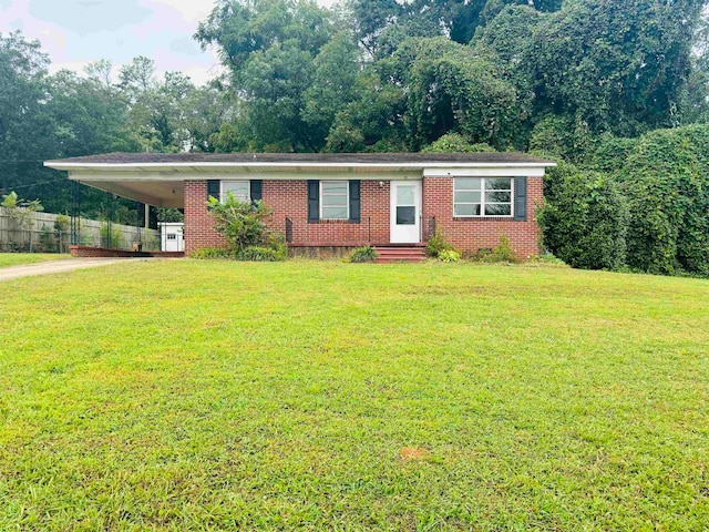 single story home featuring a front lawn and a carport