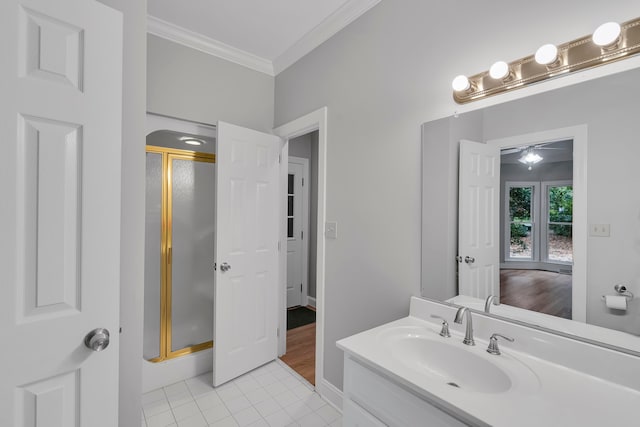 bathroom featuring ornamental molding, vanity, tile patterned floors, and a shower with shower door