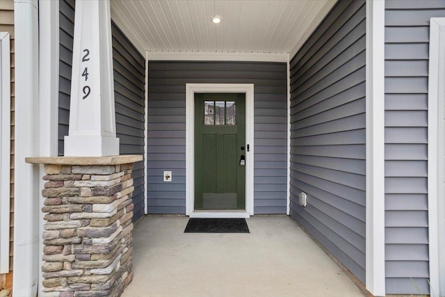 doorway to property featuring a porch