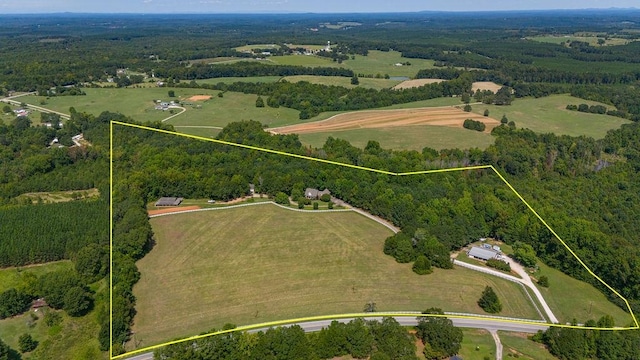 birds eye view of property featuring a rural view