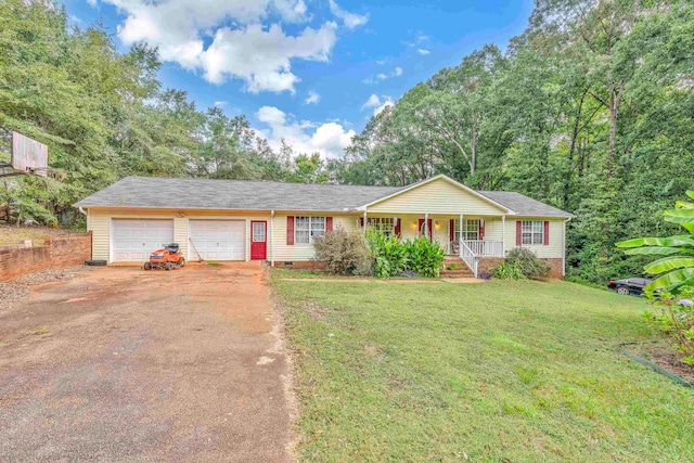 single story home featuring a front yard, a garage, and covered porch