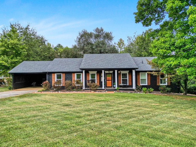 ranch-style home featuring a front yard and a carport